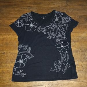 White embroidered black shirt